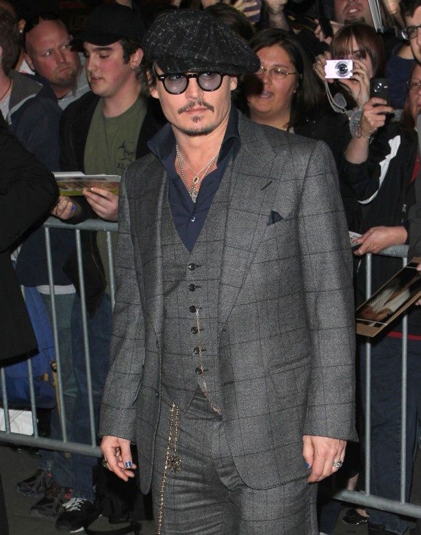 2011年10月にニューヨークのMoMAで行われた『ラム・ダイアリー』特別上映でのジョニー。アンバーも参加していた